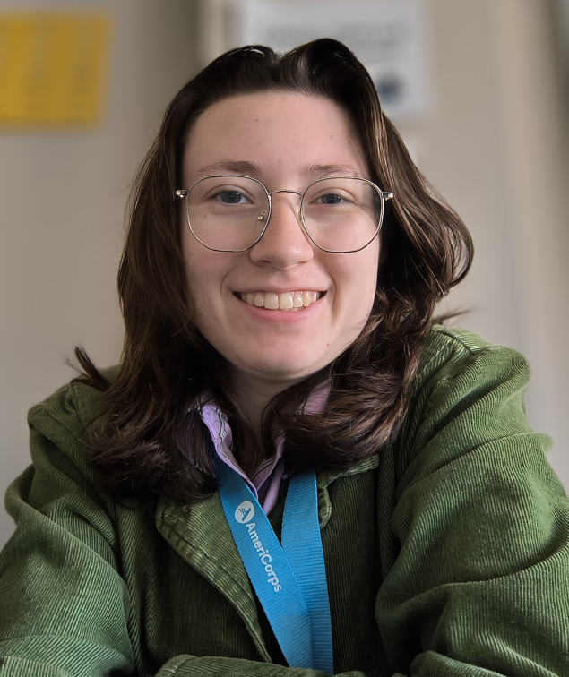 Smiling white woman with long brown hair