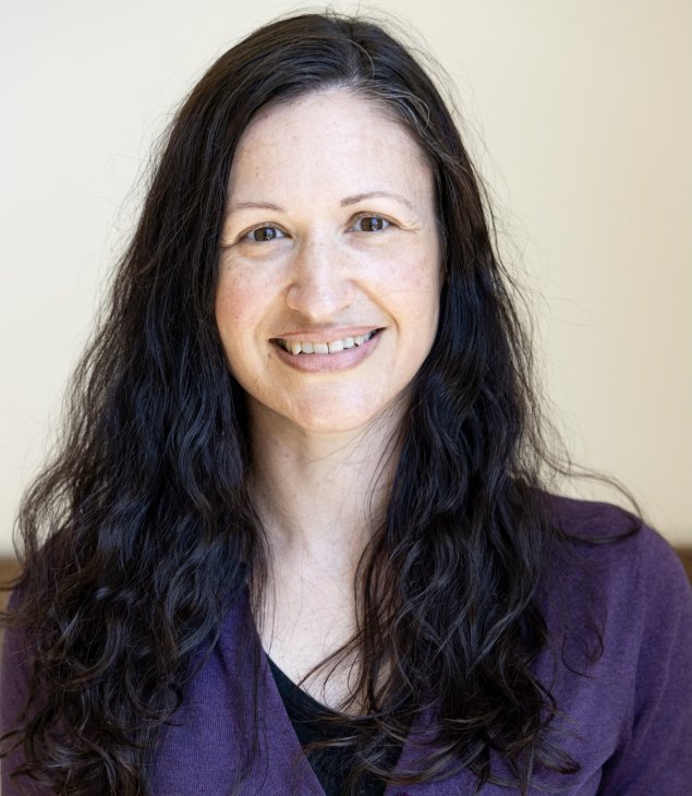 Smiling white woman with long brown hair