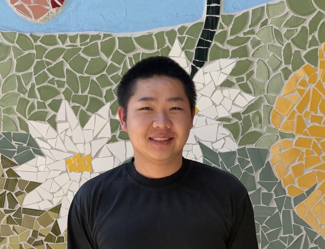 smiling asian man with short hair