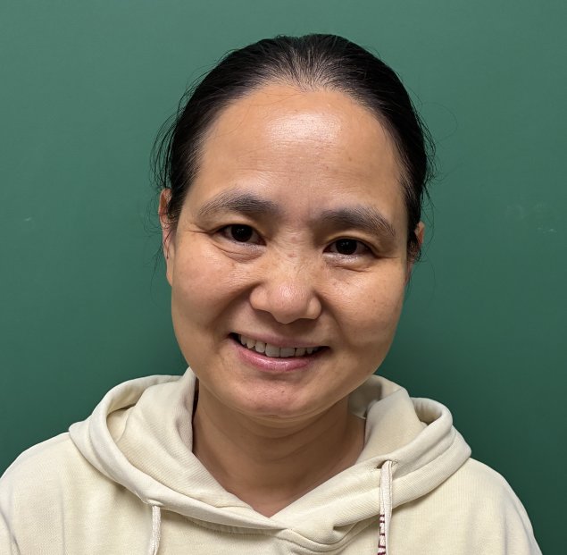 Smiling asian woman with pony tail