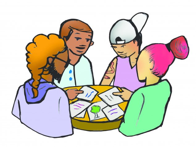 Group of people working together to look at resources