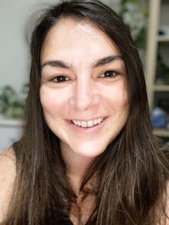 Smiling white woman with long brown hair