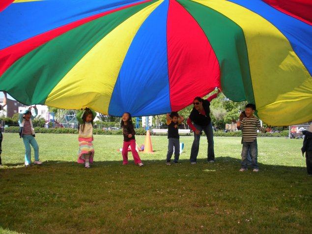 Students doing a parachute activity in PE 