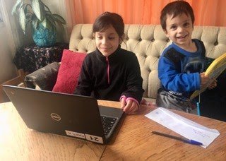 Students using SFUSD laptop for distance learning