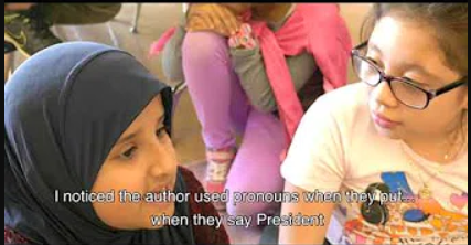 Two young female students talking about pronouns