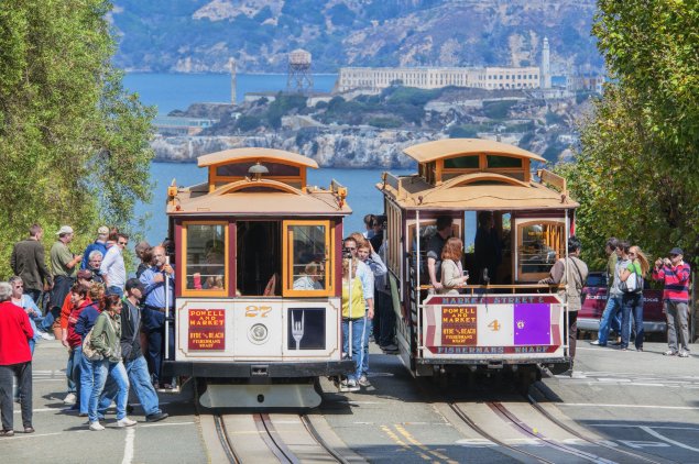 People riding cable cars in San Francisco